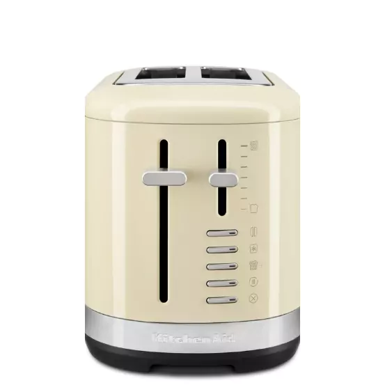 Mandulakrém színű kenyérpirító a szabályozó gombokkal és karokkal.